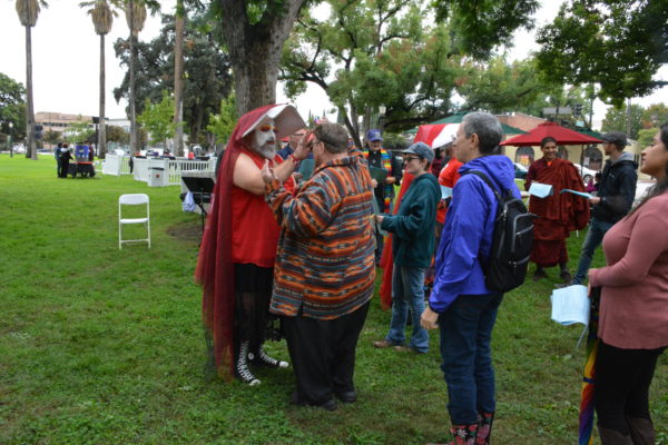 A Sister of Perpetual Indulgence administers a "Glitter Blessing" during Interfaith Service at SGV Pride 2018