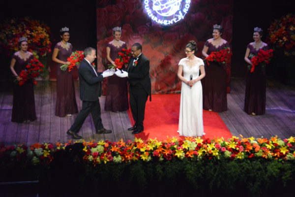 2019 Tournament of Roses President Gerald Freeny receives the Rose Queen's crown to place