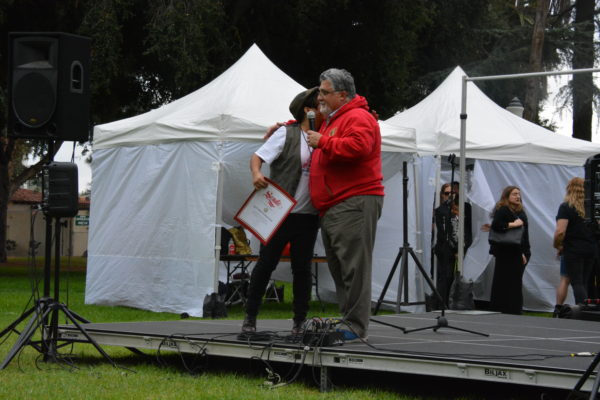 Jessica Amaya gets a hug from State Senator Anthony Portantino at SGV Pride 2018