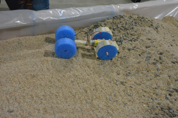 Rover navigates sand in a sandbox