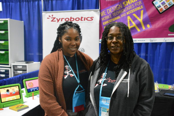 Zyrobotics CEO Dr. Johnetta MacCalla with fellow exhibitor at Zyrobotics learning technology display, during California STEAM Symposium