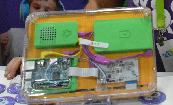 Back of the MakePad DIY tablet computer showsmulticolored wires and two green components on a yellow base