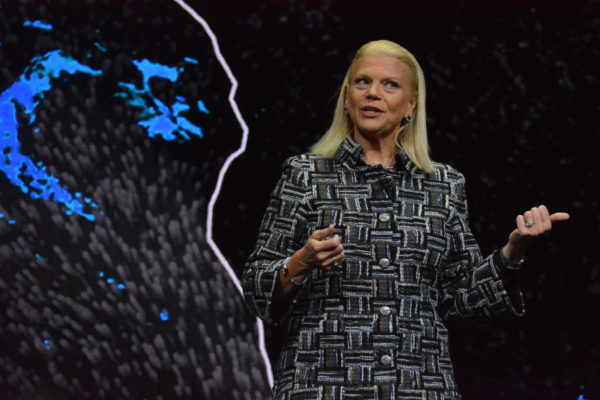 Closeup of Ginny Rometty near weather-system map slide