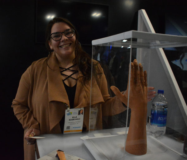 Ella Scarchilli of Unlimited Tomorrow with 3D printed robotic arm at 2019 CES Eureka Park exhibit