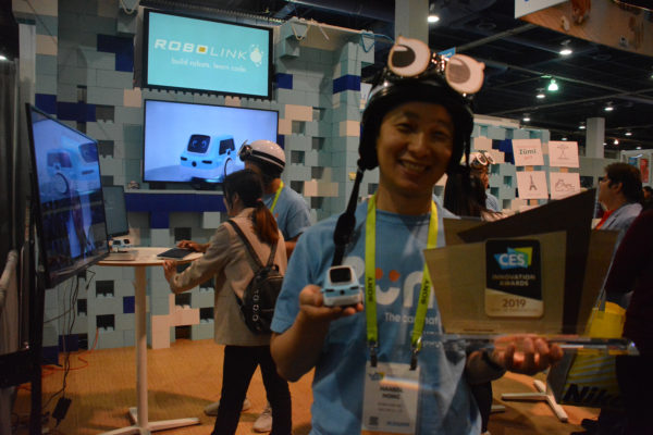 Hansol Hong of Robolink displays his new Zumi robot and CES Innovation Award during CES 2019