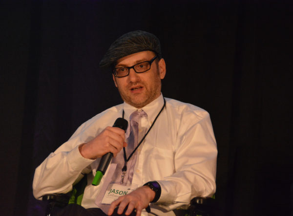 Closeup of Patient Advocate Jason Lieberman, speaking on mic during Virtual Medicine conference 2019