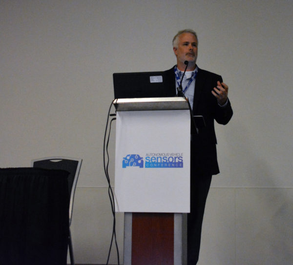 Tom full-length shot as he speaks from Autonomous Vehcile Sensors Conference podium