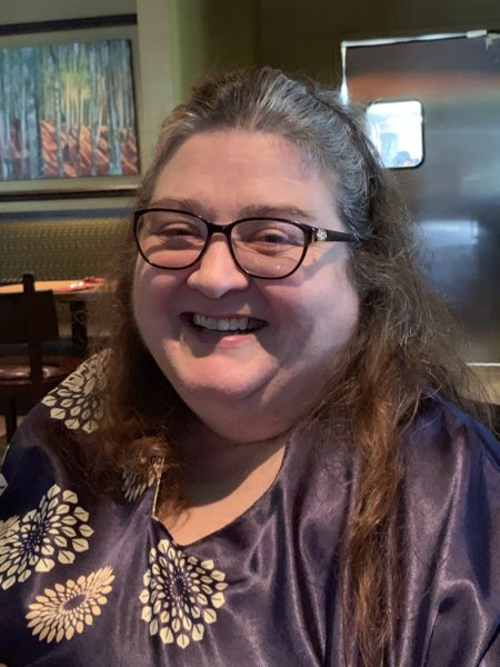 Autonomy Foundation Co-Founder and Chief Operations Officer Misha Houser smiles in closeup against restaurant background