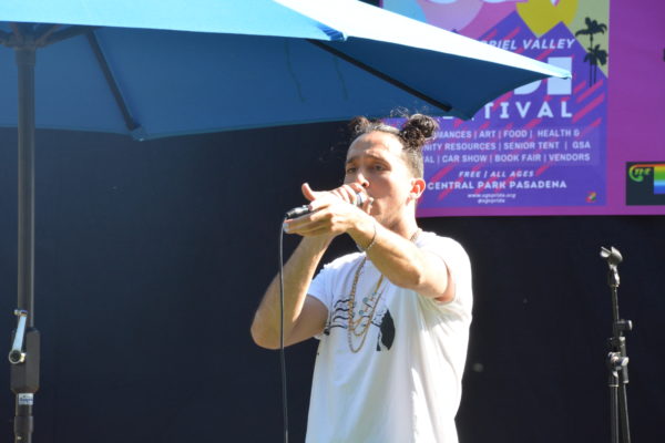 Rapper Figgy Baby points a finger at audience during his set at San Gabriel Valley Pride 2019