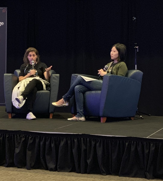 Nicki Stone gestures while answering a question from Michele Kung during the first Fireside Chat of TechDay LA 2019