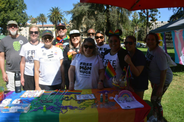 Free Mom Hugs volunteers at their table at SGV Pride 2019