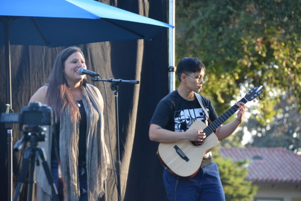 Niccole sings as Ace plays guitar during San Gabriel Valley Pride 2019