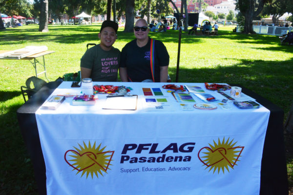 Staffers smile from PFLAG booth at San Gabriel Valley Pride Festival 2019