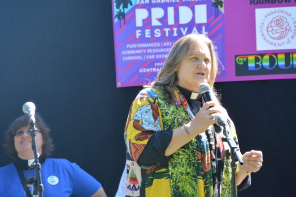 Reverend Pat speaks into mic as Reverend Kelli looks on at SGV Pride 2019