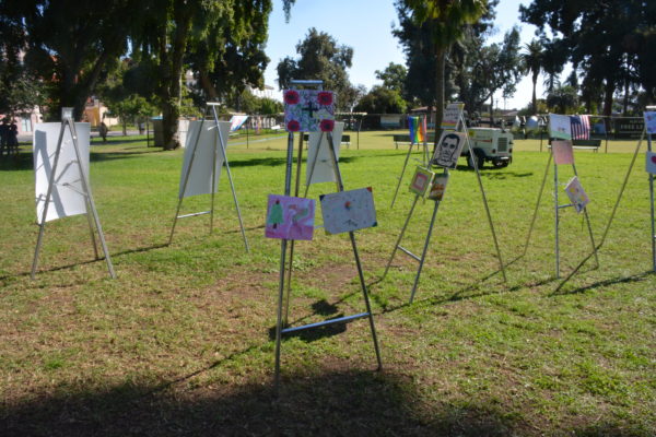 Art from Big Draw LA on easels for sale at San Gabriel Valley Pride