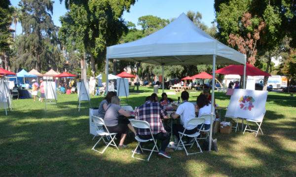 Attendees at San Gabriel Valley Pride 2019 draw hearts