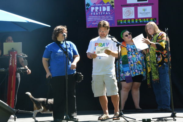 Four ministers read from program onstage during San Gabriel Valley Pride 2019