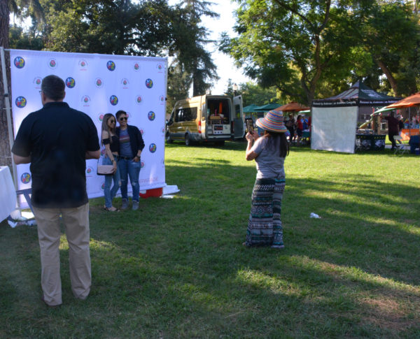 Atendees pos beofre Tournament of Roses screen as Vice President Madigan looks on at San Gabriel Valley Pride 2019