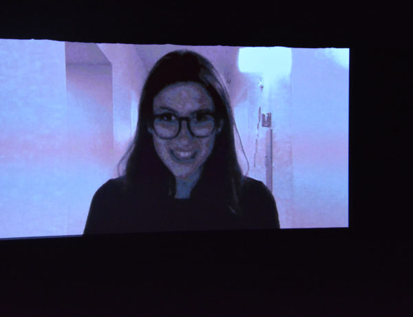 Former Rose Queen® Louise Deser Siskel on a giant screen via Skype