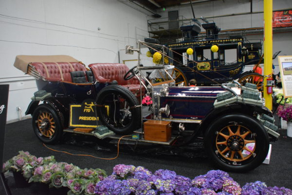 1911 Rolls-Royce with two rows of seats and yellow-spoked wheels
