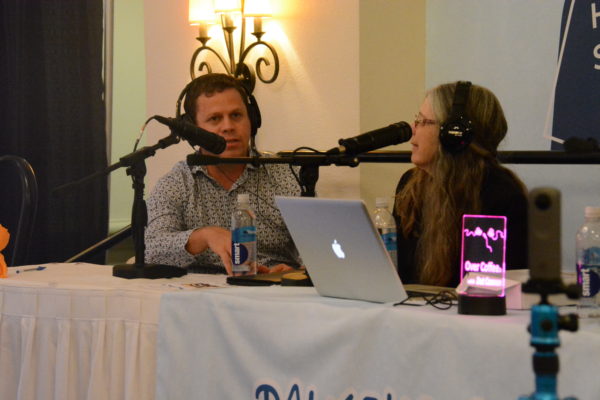 NASA Integration Engineer Shaun Daly talks with Over Coffee host Dot Cannon during onsite taping of the podcast during Podcast Movement 2019, at the Talkshoe booth