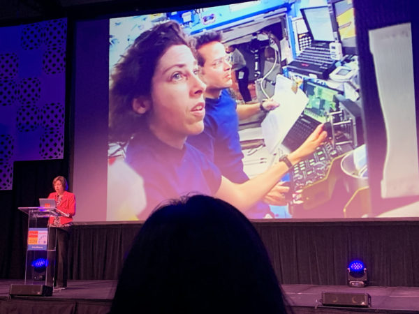 Dr. Ochoa displays slide of herself as Atlantis flight engineer during California STEAM Symposium 2019