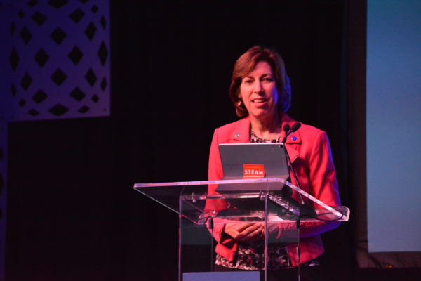 Ellen Ochoa smiles form the lectern of California STEAM Symposium