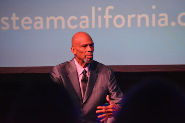 Closeup of Kareem Abdul-Jabbar gesturing as he makes a point