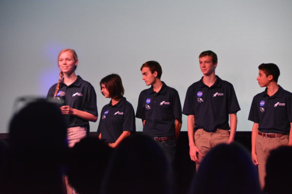 Closeup of Oak Park team as Toni holds the mic