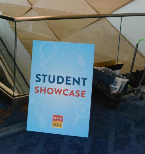 Student Showcase sign against a glass partition at California STEAM Symposium