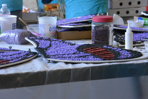 Purple butterfly with outline of wings in black seeds and red spots on its wings