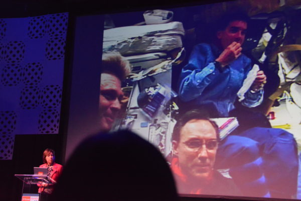 Dr. Ellen Ochoa shows slide of crew eating aboard the space shuttle during Californis STEAM Symposium 2019