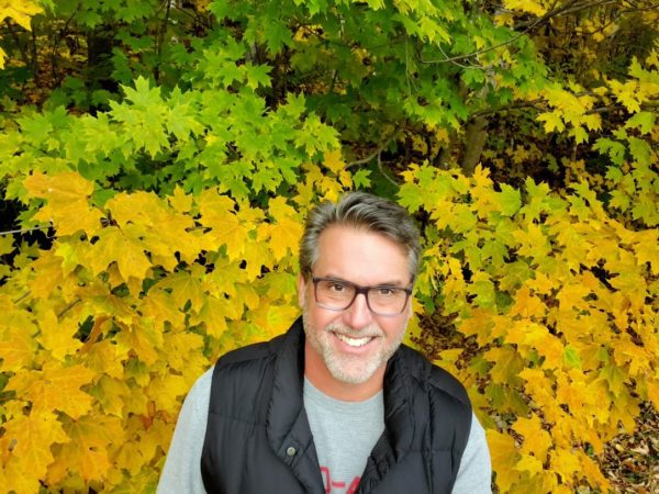 HYPERVSN USA Regional Director Ed Teller against a background of yellow and green leaves