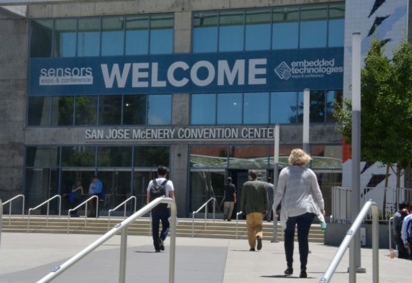 Attendees walk into San Jose McEnery Conference Center, which has "Sensors Expo, WELCOME" banner above the doors
