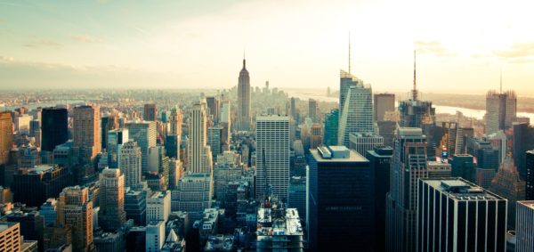 Manhattan with Empire State Builidng in center in early morning 