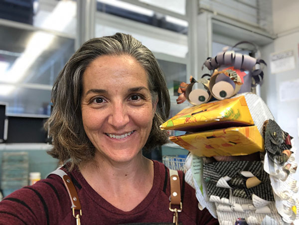 Culver City Unified School District Art and Innovation Lab Teacher Eileen Pottinger with a big-eyed bird handpuppet crafted from cardboard
