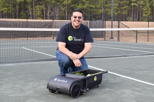 Haitham Eletrabi on the tennis court, with his "Tennibot" robot