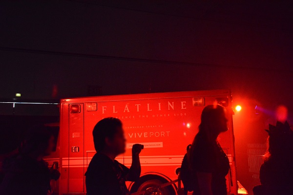 Visitors to Scare LA Halloween convention line up outside the Flatline Experience ambulance