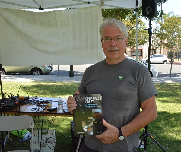 Dave Doody, lead engineer of the Cassini mission, with his book Deep Space Craft, in Pasadena's Central Park