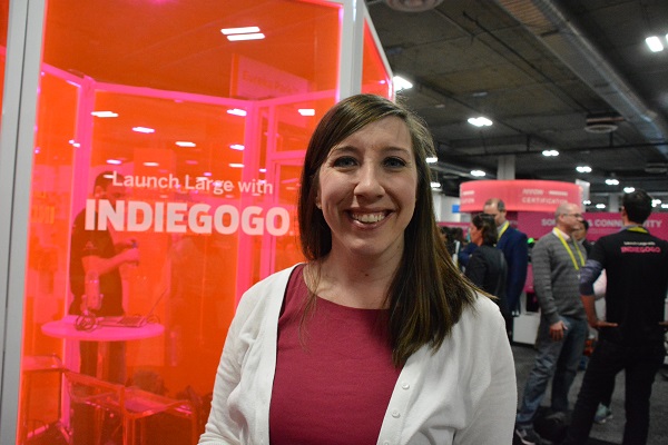 Kate Drane, Indiegogo Senior Director of Outreach for Tech and Hardware, beside Indiegogo sign at Eureka Park 2017 with conference attendees in the background