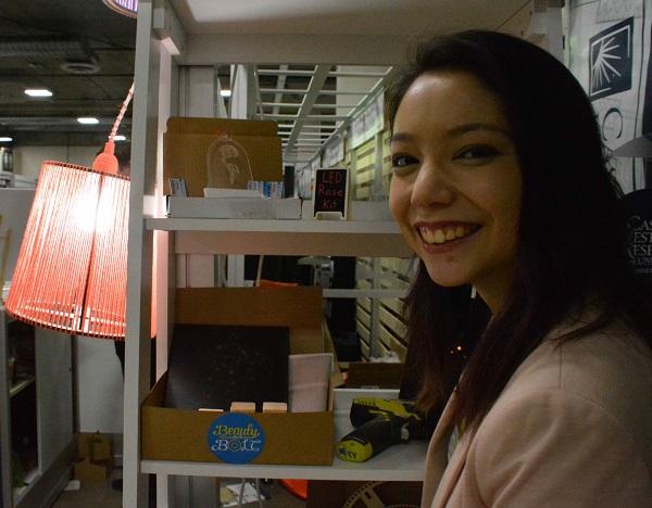 Beauty and the Bolt co-founder Xyla Foxlin next to a stand of STEAM crafts kits