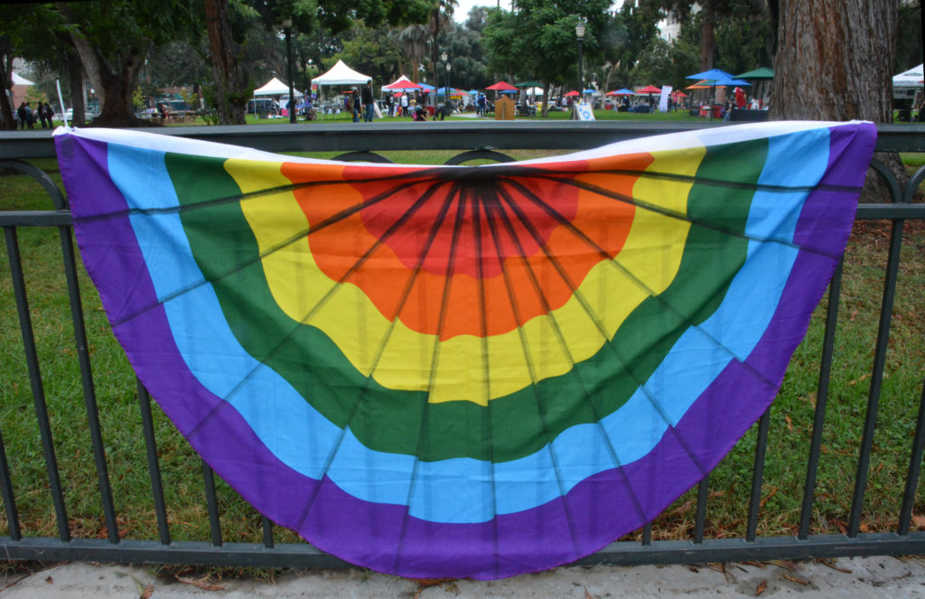 San Gabriel Valley Pride Festival 2018 tents in Pasadena's Central Park beyond rainbow bunting