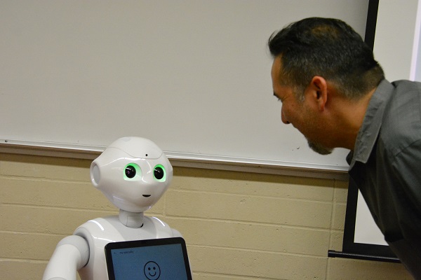 Pepper robot gauges emotion as roboticist Walter Martinez smiles