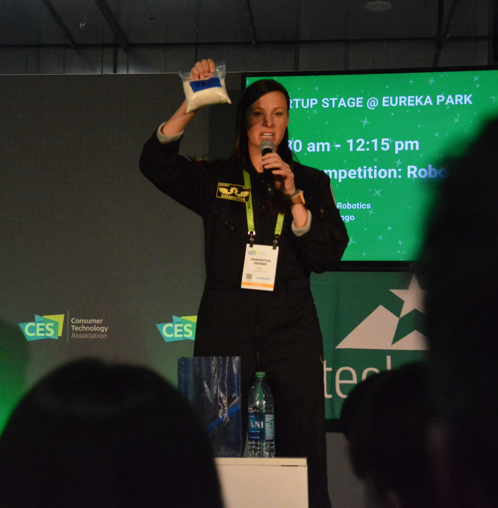 re:3d catalyst and co-founder Samantha Snabes holds up a plastic bag during her pitch at the Techstars competition, Eureka Park 2019