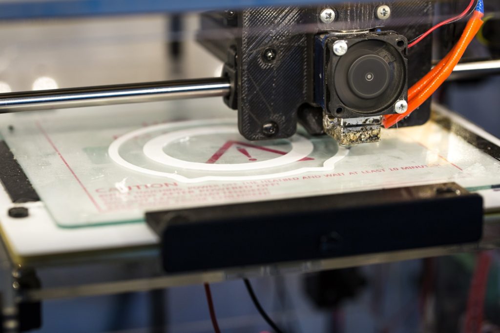 Closeup of 3D printer printing a white circle