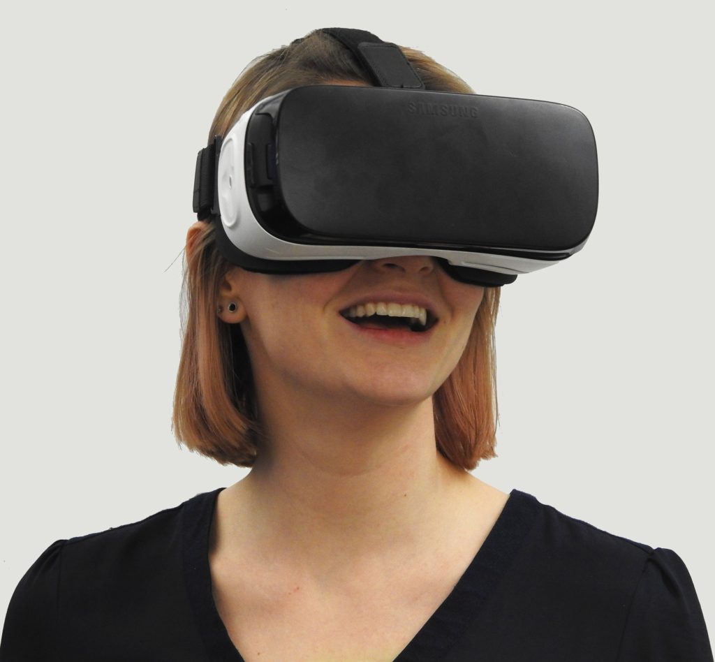 Smiling woman in a VR headset