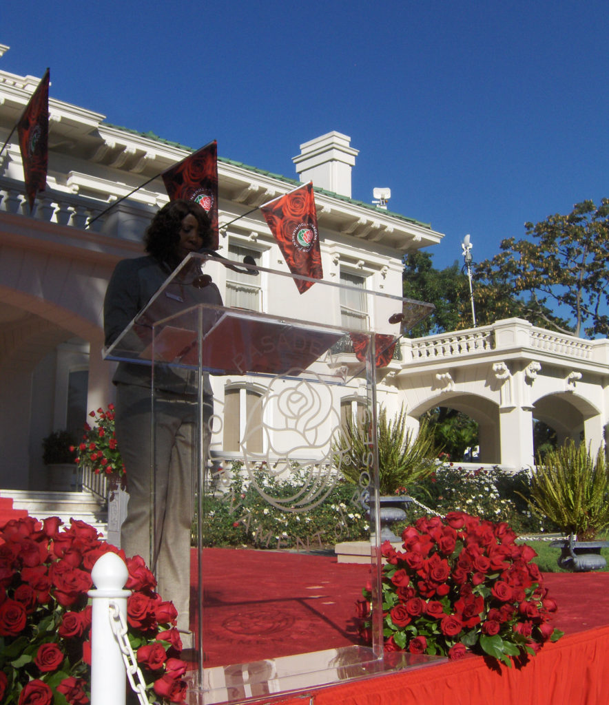 Tournament House with red  roses in front of it