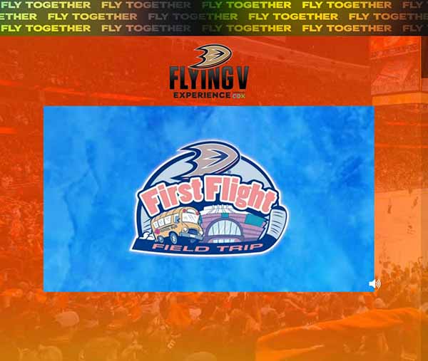 "First Flight Field Trip" orange lettered logo with school bus beneath it, on a computer screen