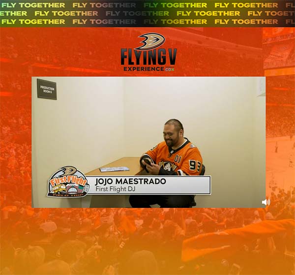 Jojo sits at desk playing a game on his phone as banner shows "Jojo Maestrado, First Flight DJ".