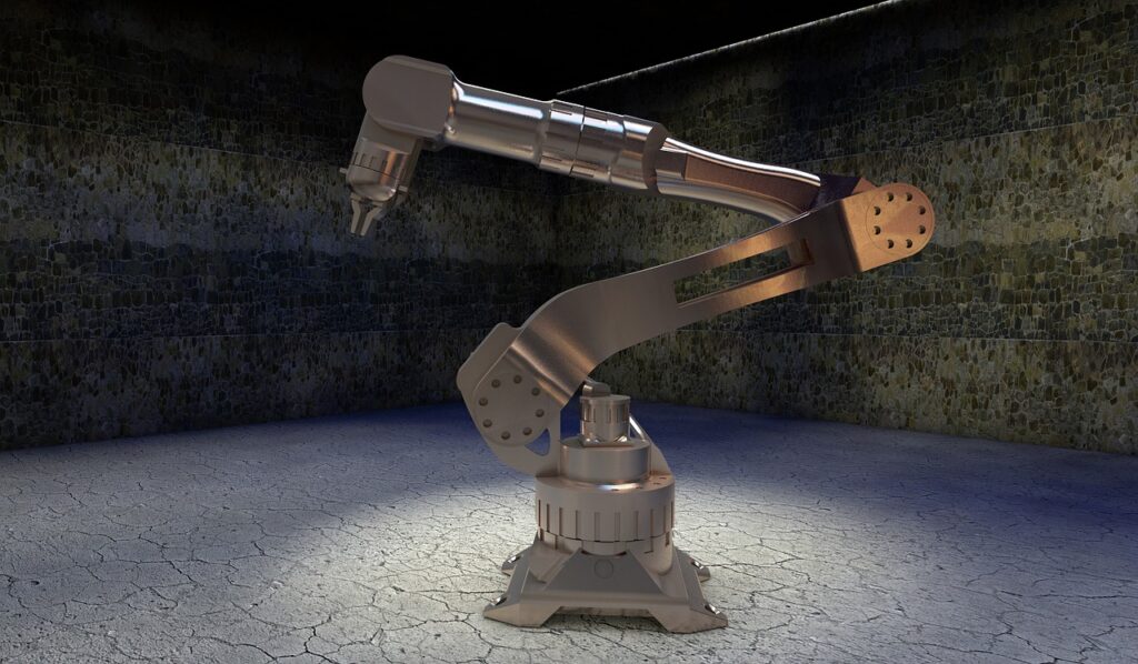 Silver robotic arm on a concrete surface